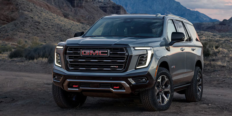 GMC SUV parked on a rugged off-road terrain