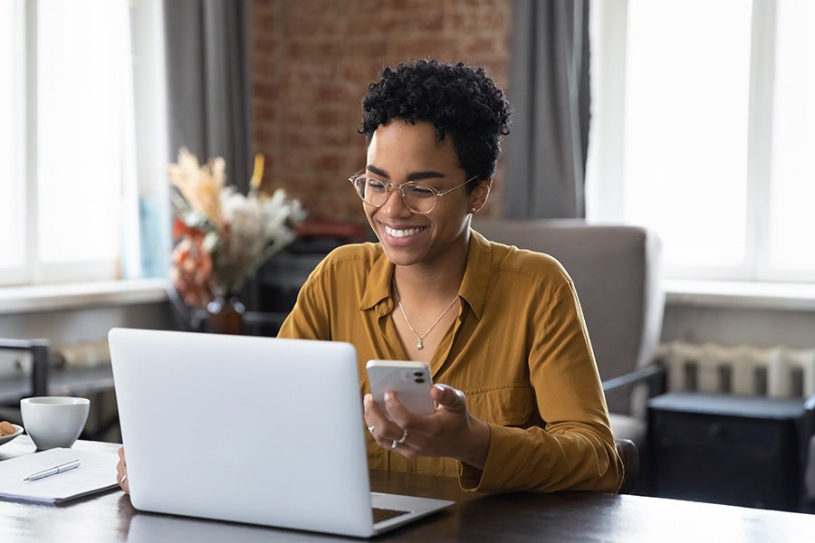 Photo of a happy customer working on a computer
